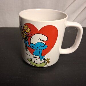 1981 Peyo Shy Blue Smurf Coffee Mug  Heart Flowers Graphic  Collectible
